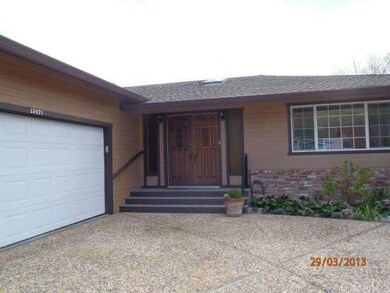 Closeup of entry and 2-car garage.
