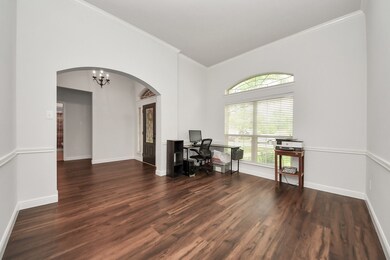 This room features elegant vinyl wood flooring, la