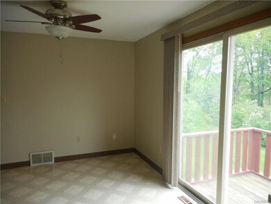Dining room has vinyl floor and pretty ceiling fan