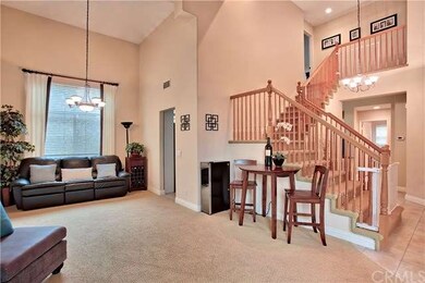 Living/dining area with high ceilings and view tow