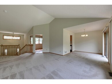 Dining area open to living room, with walkout to d