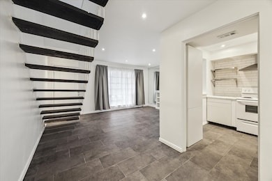 Two story loft with LED recessed lighting.