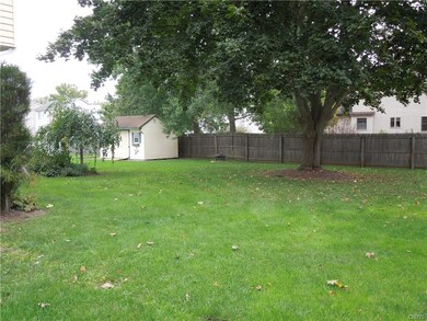 Back Yard with mature tree and fence for privacy