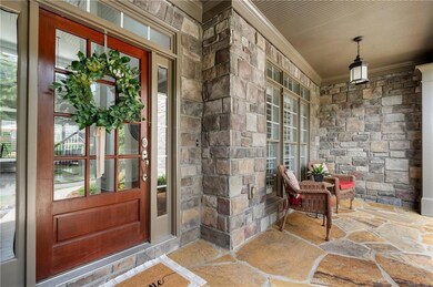 View of exterior entry with covered porch, french 