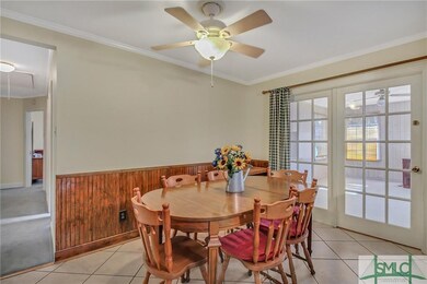 A multi-lite atrium door opens to the sunroom.