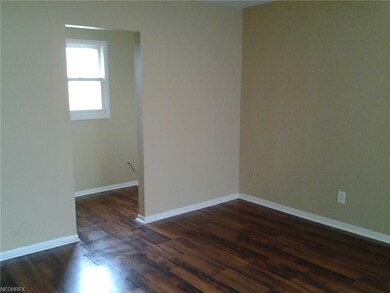 Family room with brand new laminate flooring.  Sma
