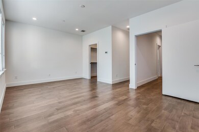 Empty room with wood finished floors and baseboard