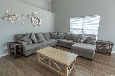 Living room with wood-type flooring