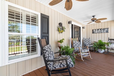 Deck featuring ceiling fan and a porch