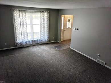 A look at the living room off of the front entranc