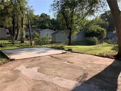 Lots of parking space and a concrete slab all read