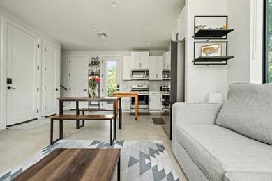 Living room with finished concrete floors and rec