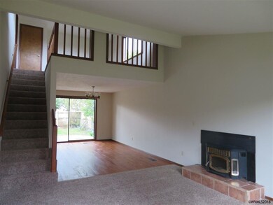 Open main living room with pellet stove, new carpe