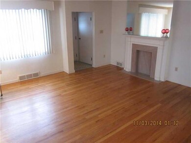 Living Room. Marble decorative fireplace with glea