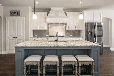 A gorgeous subway tile backsplash with added herri
