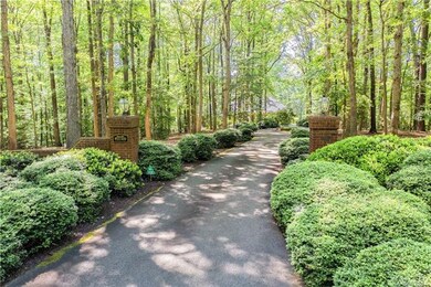 The stately columns with mechanically controlled lighting and the paved driveway leads you to this nicely tucked away lake front home