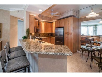 Kitchen - Updated kitchen features granite counters & backsplash, KitchenAid French door stainless steel refrigerator/freezer, dishwasher, oven/range & microwave!