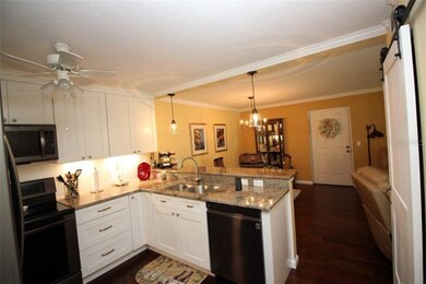 Kitchen photo looking out to the dining area and f