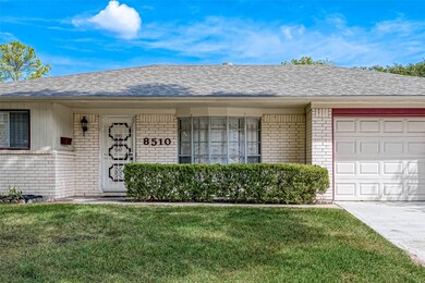 Large windows, a characteristic feature of midcentury design, are strategically placed throughout the facade. These windows allow abundant natural light to fill the interior and contribute to the home's overall aesthetic appeal.