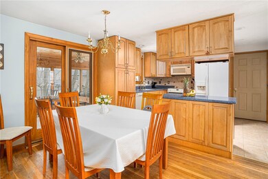 Kitchen Dining area.  Sliding door to sunroom. Din