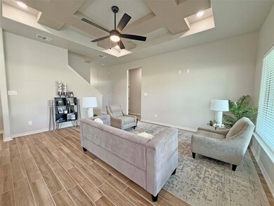Living room with coffered ceiling, light wood-styl