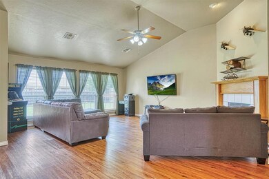Living room with wood-type flooring, high vaulted 