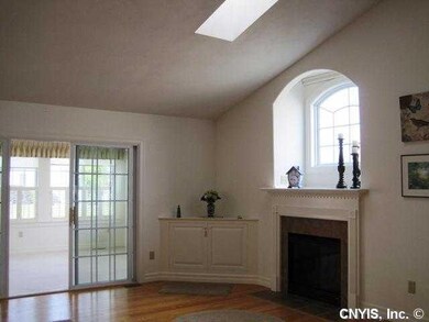 Great Room. Showing gas fireplace and sliding glas