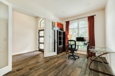 Spacious office with double glass doors and lots o