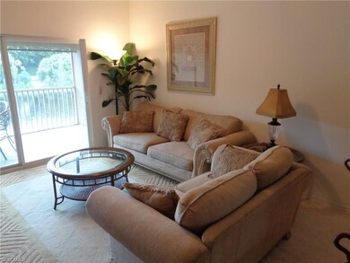 Living area looking toward lanai and lake view