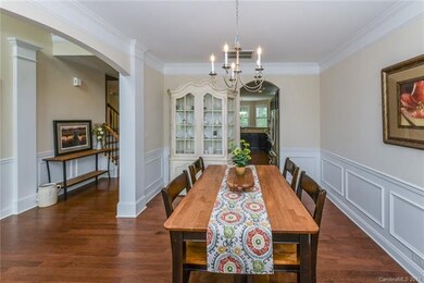 Spacious formal dining room leading to kitchen