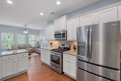 Well-Appointed Kitchen Featuring Sleek Stainless Steel Appliances, Gas Range, and Spacious Layout Ready for Your Next Culinary Creation!