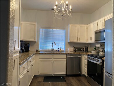 UPGRADED KITCHEN WITH WHITE CABINETS, SS APPLIANCE