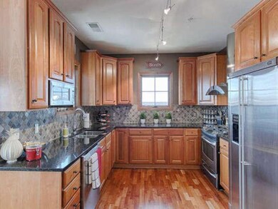 Custom cabinetry,tile back splash,stainless applia