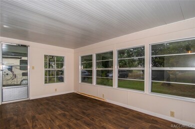 Front porch facing the side yard from the front door of the living room.