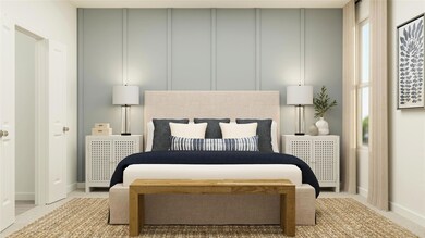 Bedroom featuring a decorative wall and light colo