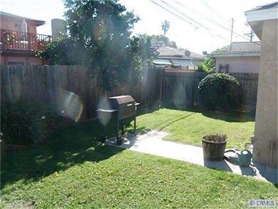 Back yard behind the two car garage large grass area