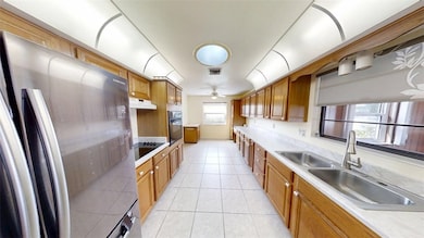Kitchen with Medium brown cabinets