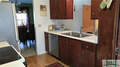 Kitchen with Formal Dining Room through passageway