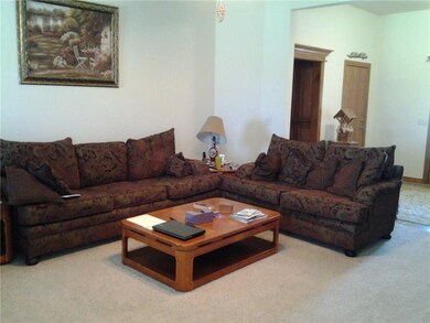 Living Room with a view of a large entry