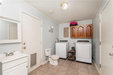 Utility room w/ half bath