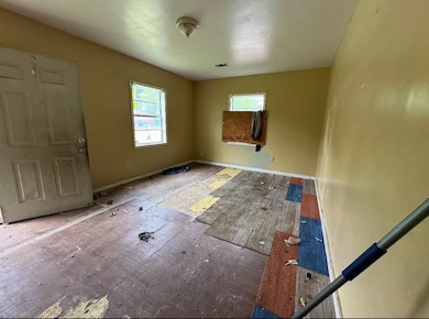 Foyer with healthy amount of natural light and baseboards