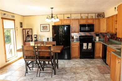 Bright kitchen dining combo w/ tile flooring & cus