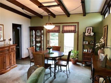 12X13 DINING ROOM WITH WOOD BEAMS, PATIO DOORS OPE