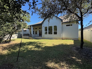 Back of house with stucco siding