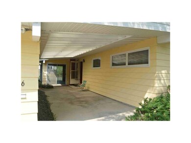 . Covered patio between garage and house