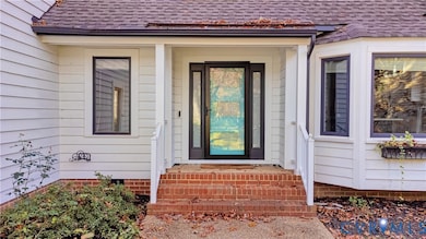 Property entrance with a shingled roof