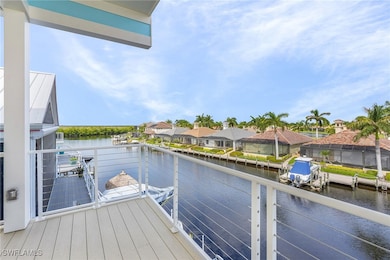 View of dock with a balcony and a water view