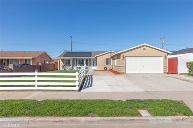 Charming curb appeal with a pristine white picket fence framing this lovely single-story abode
