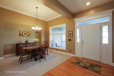 Entry is open to the formal dining room with beaut