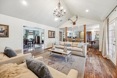 The residence showcases vaulted ceilings, a cozy g